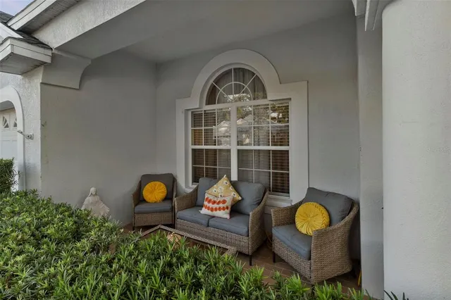 a view of a house with a backyard and a table and chairs