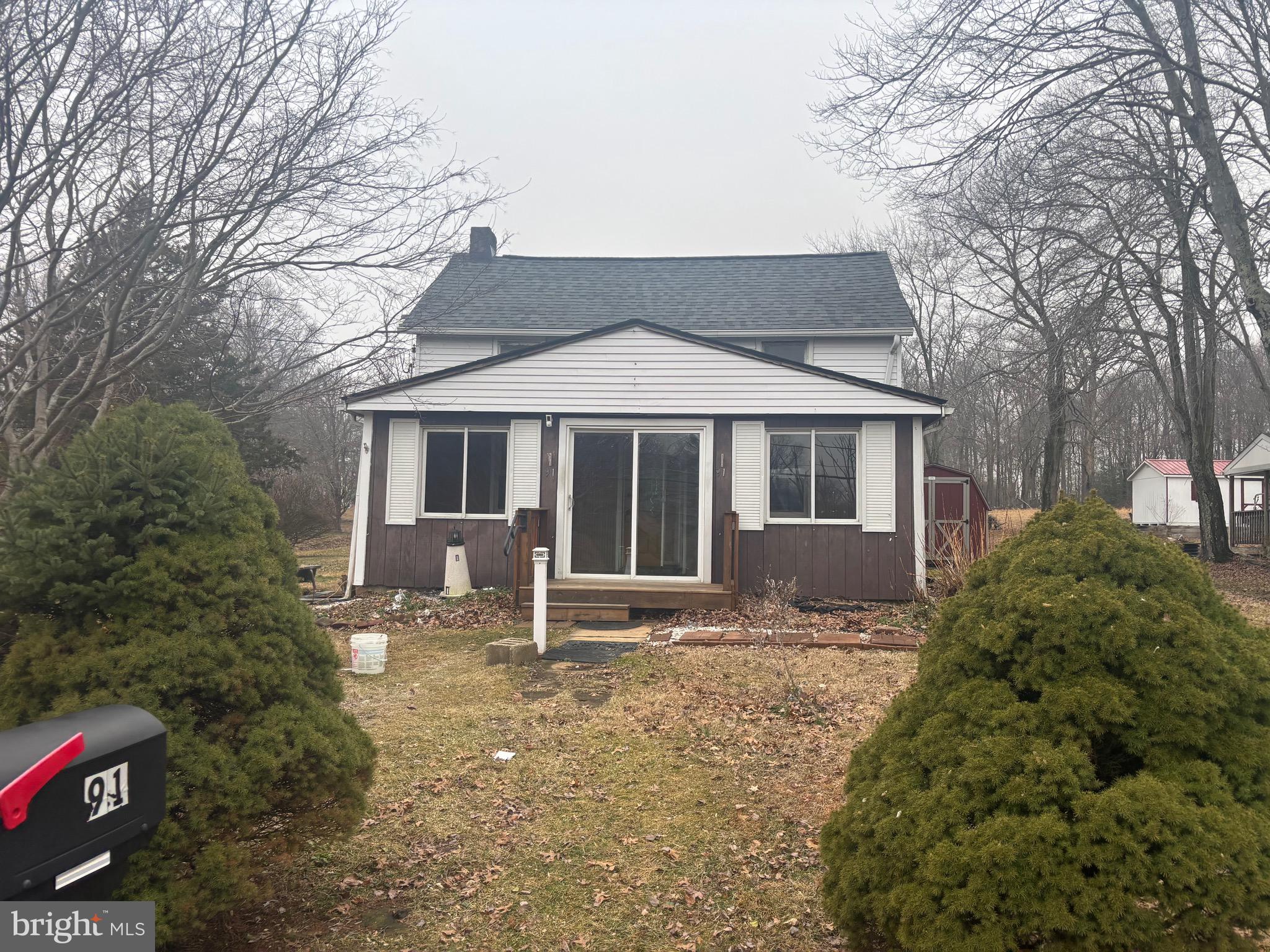 91 Middle Road Elkton, MD 21921 - Photo 1 of 11 a front view of a house with yard and green space