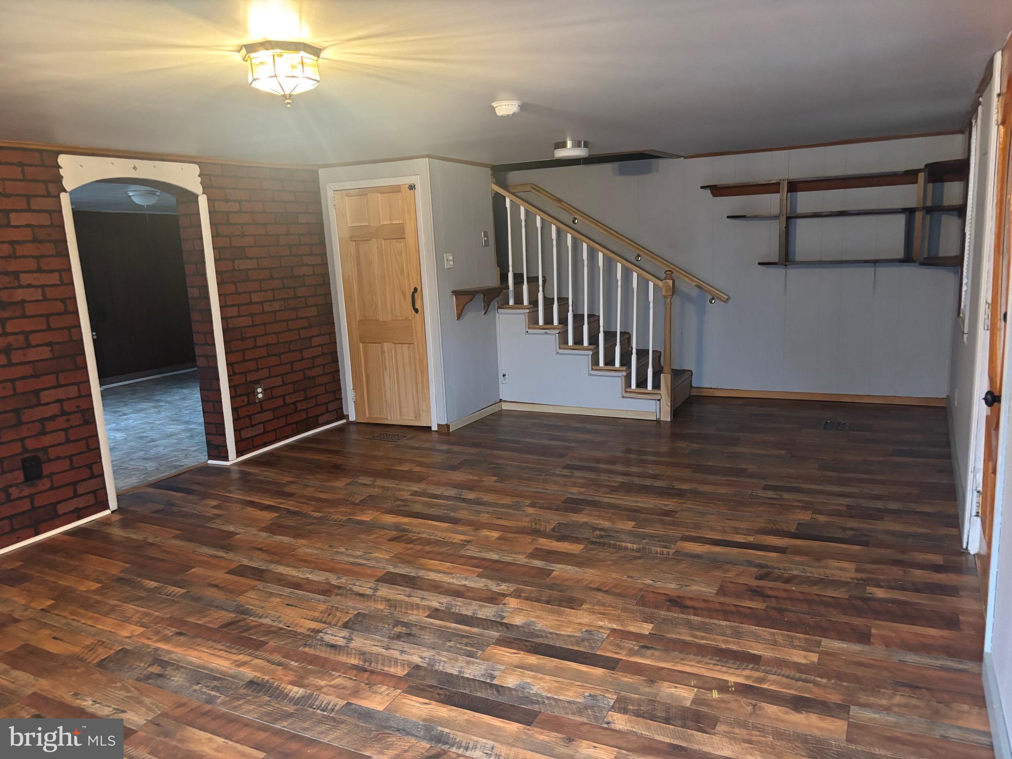 91 Middle Road Elkton, MD 21921 - Photo 2 of 11 a view of a hallway with wooden floor and staircase