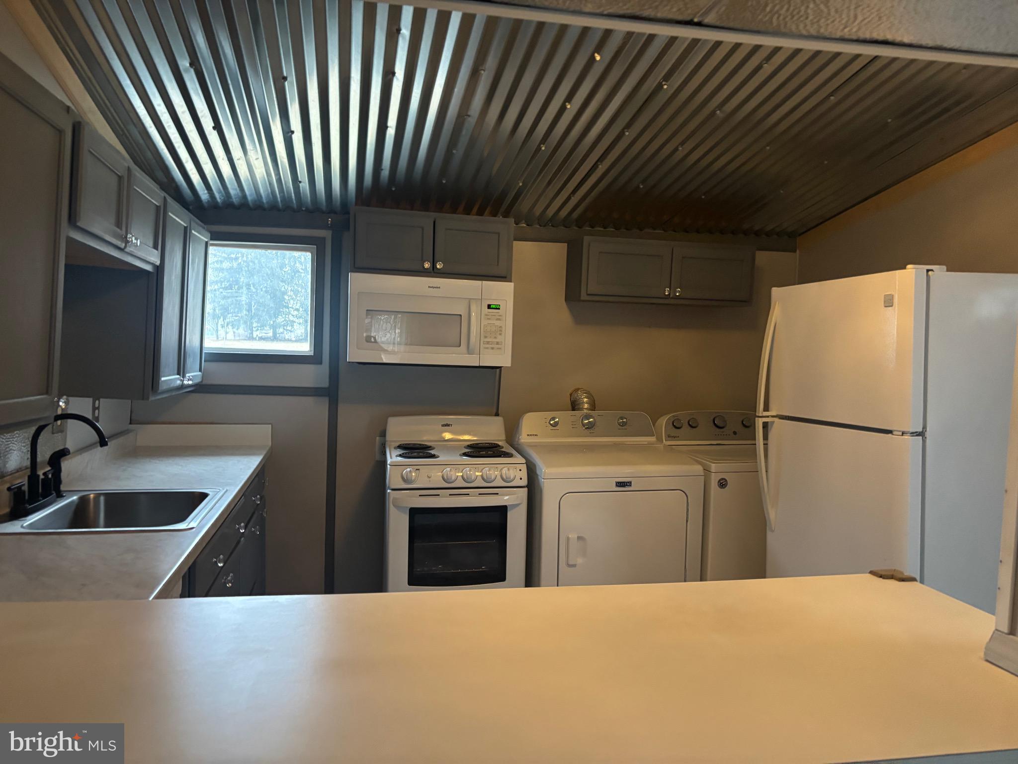 91 Middle Road Elkton, MD 21921 - Photo 5 of 11 a kitchen with stainless steel appliances a refrigerator sink and stove