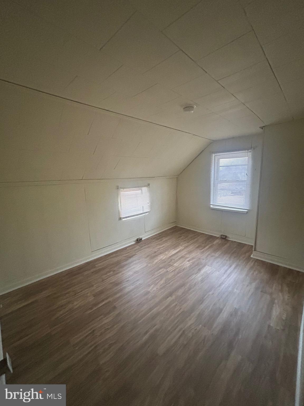 91 Middle Road Elkton, MD 21921 - Photo 10 of 11 an empty room with wooden floor and windows