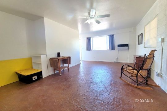 1549 South Gordon Street Ridgecrest, CA 93555 - Photo 15 of 44 a living room with furniture and a chandelier