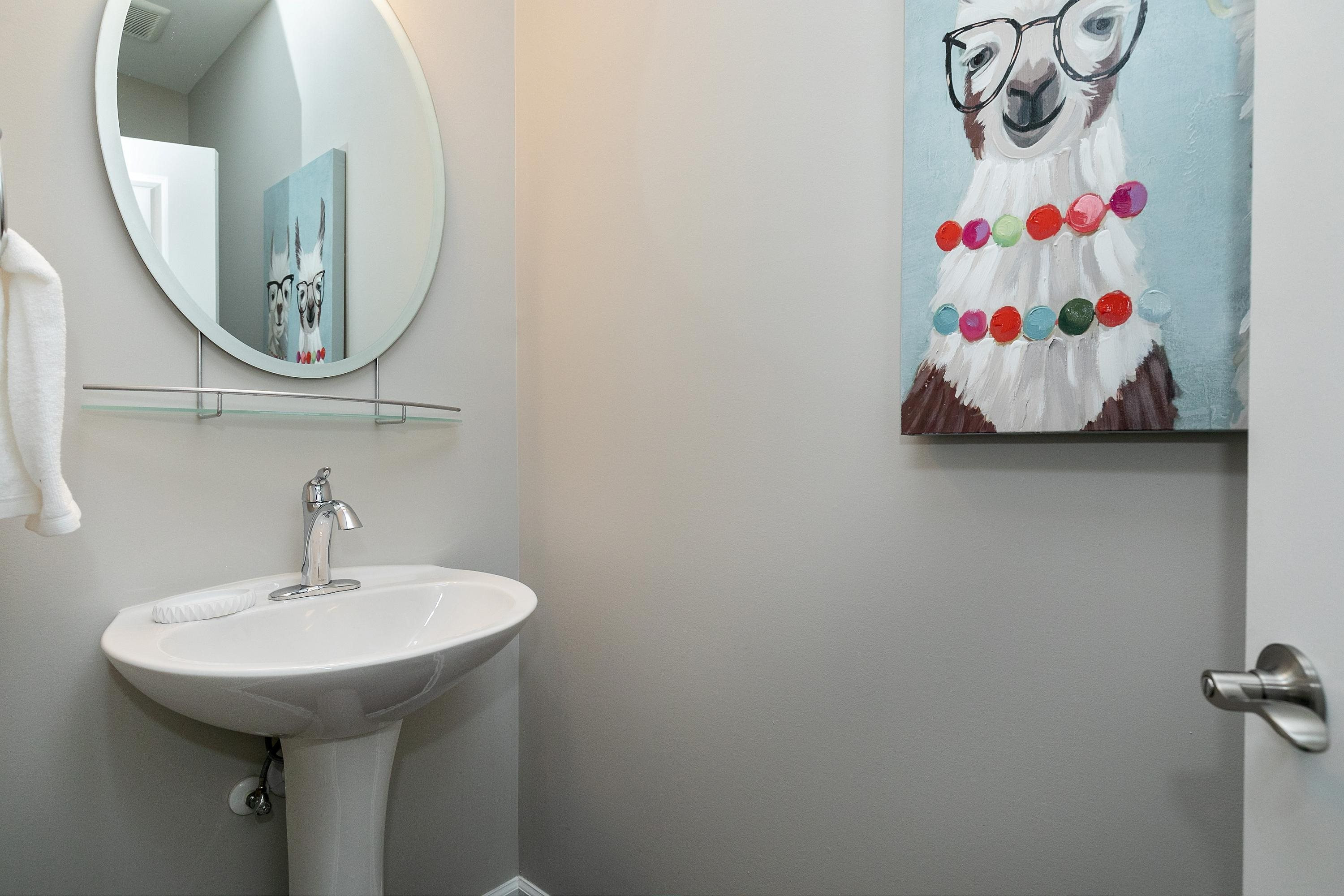811 Atticus Way Durham, NC 27703 - Photo 24 of 33 a bathroom with a sink and a mirror