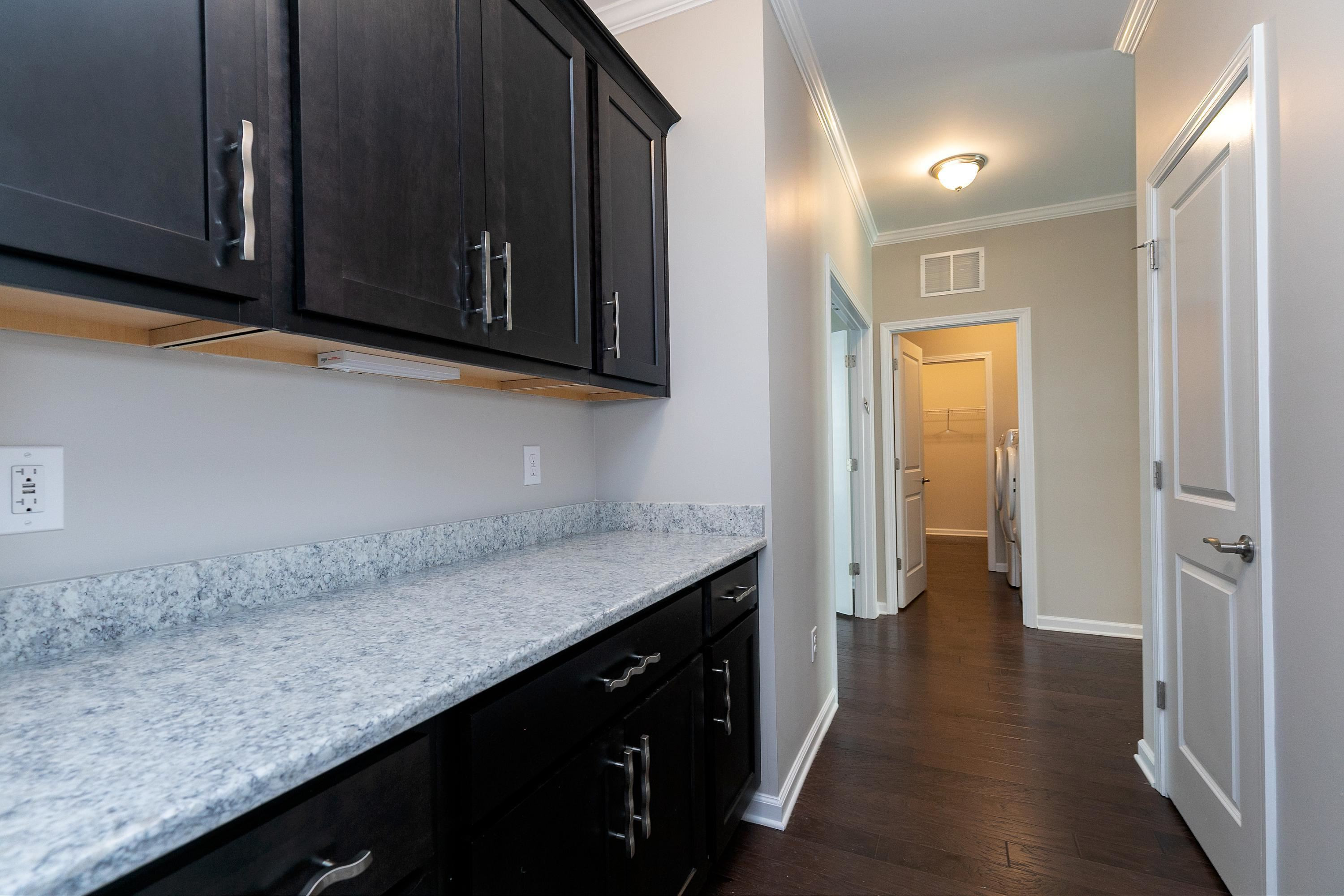811 Atticus Way Durham, NC 27703 - Photo 26 of 33 a bathroom with a sink and a mirror