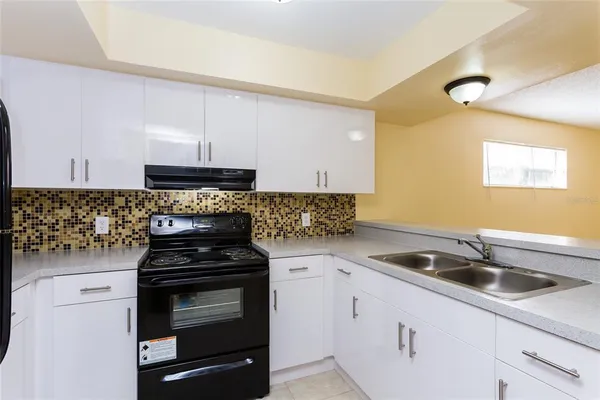 a kitchen with a sink and cabinets