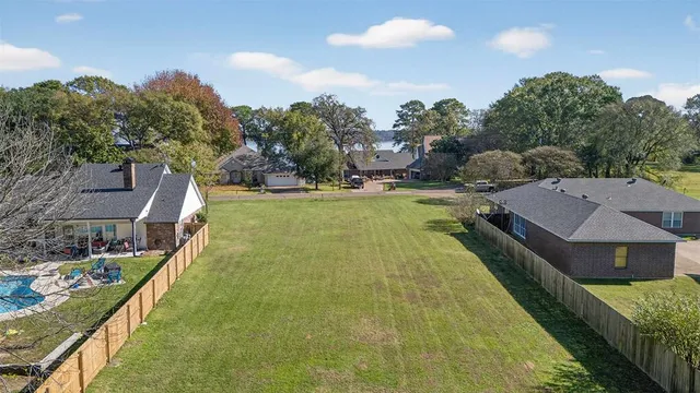 a view of a house with swimming pool and sitting area