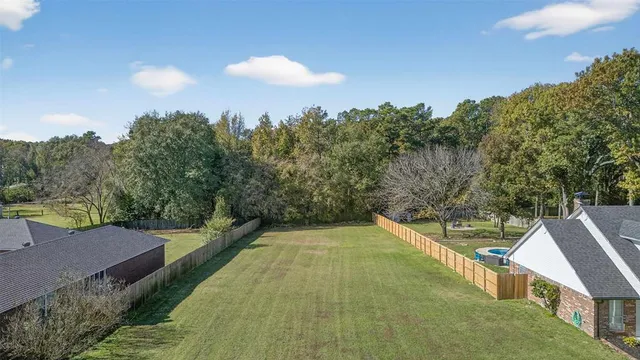a view of balcony with yard
