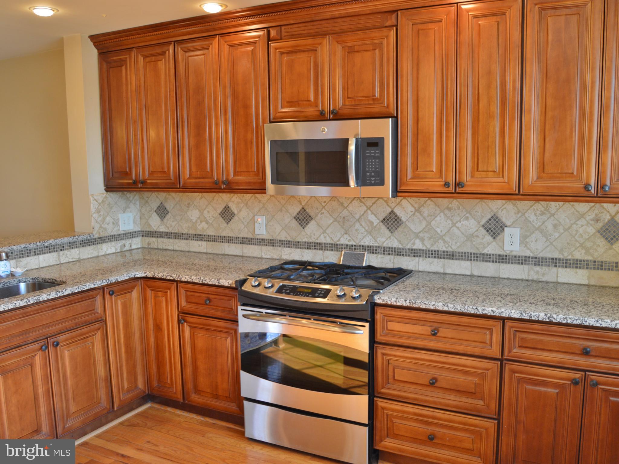 12010 Millbrook Road Philadelphia, PA 19154 - Photo 8 of 36 Granite counters
Tile backsplash