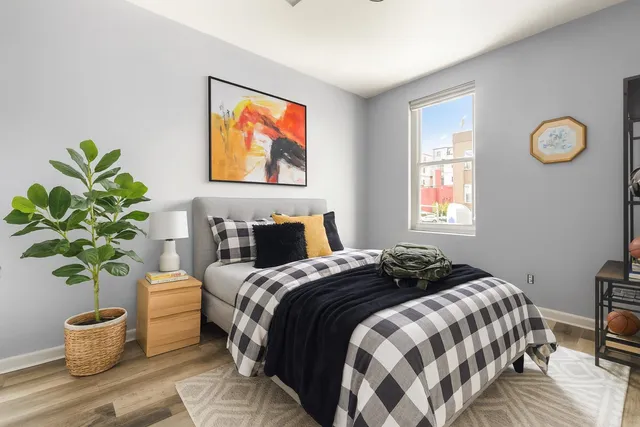 a bedroom with bed and a window