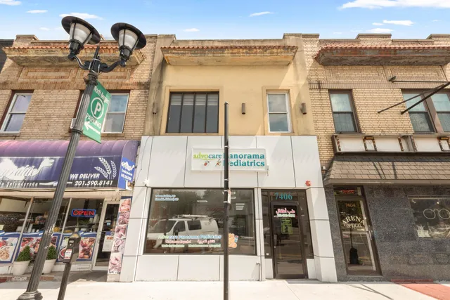 a front view of a building with multiple windows