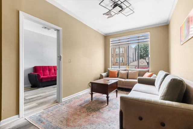 a living room with furniture and a window