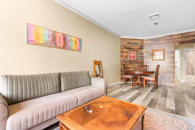 a living room with furniture and a rug