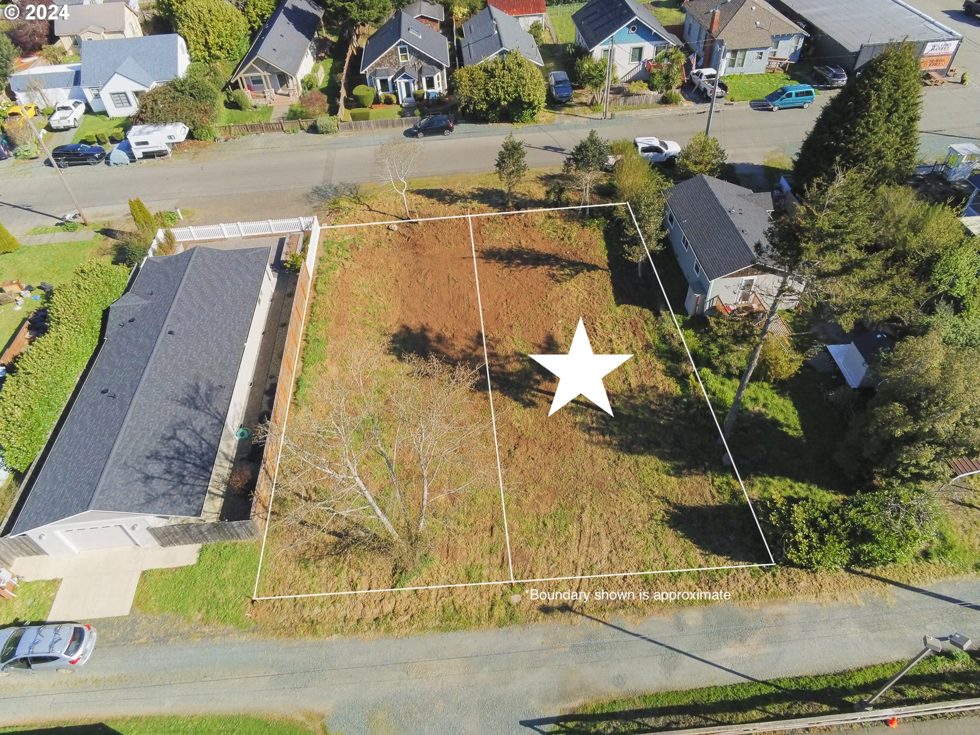 1st Street Southeast, Unit 7800 Bandon, OR 97411 - Photo 2 of 8 an aerial view of a house with a yard