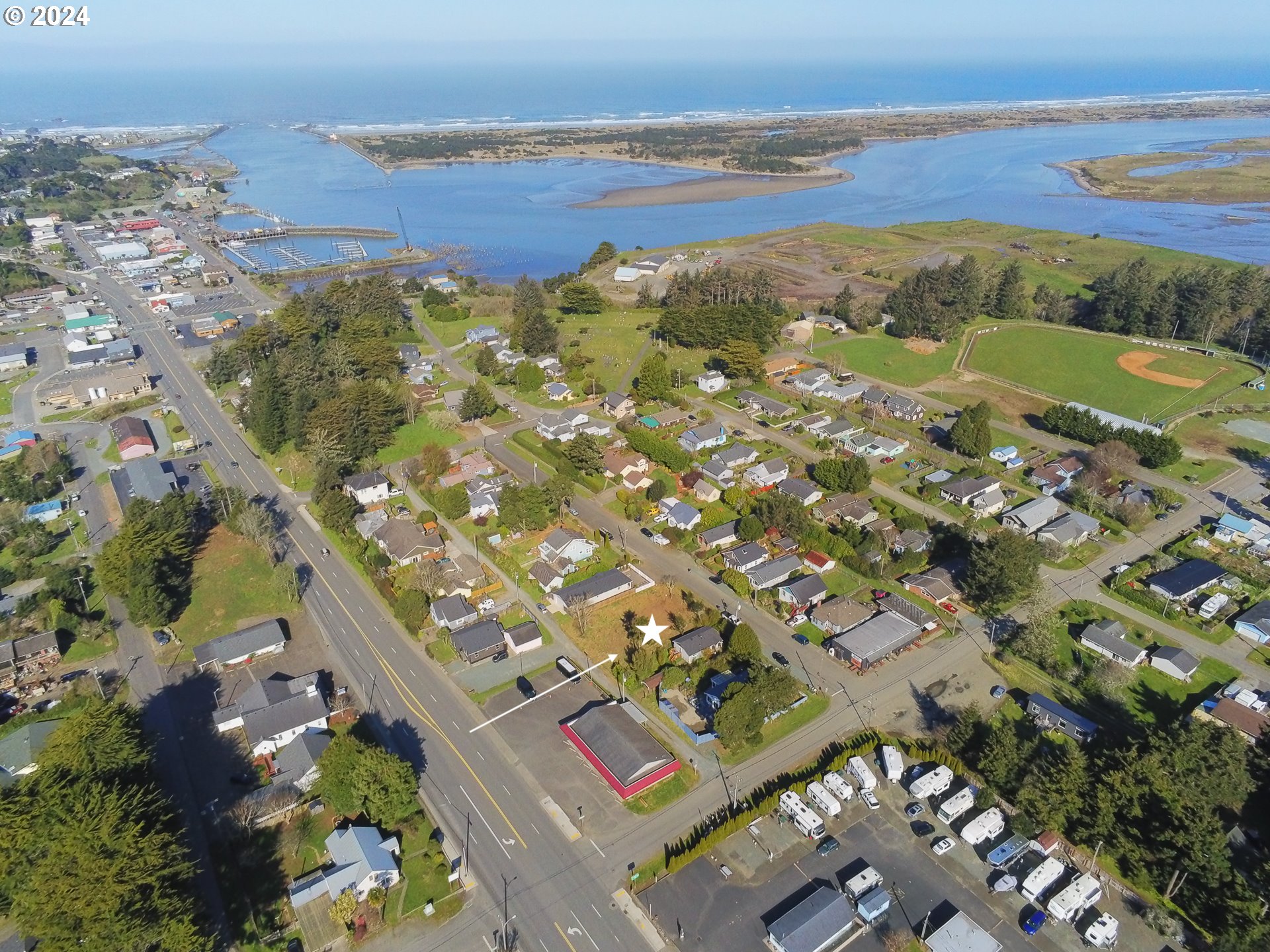 1st Street Southeast, Unit 7800 Bandon, OR 97411 - Photo 4 of 8 a view of a city with an ocean