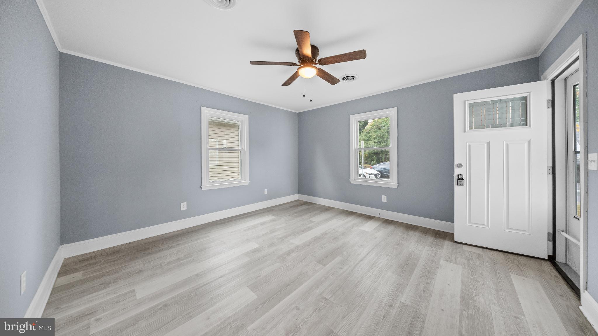 1007 Spring Avenue Salisbury, MD 21804 - Photo 3 of 13 a view of empty room with wooden floor and ceiling fan