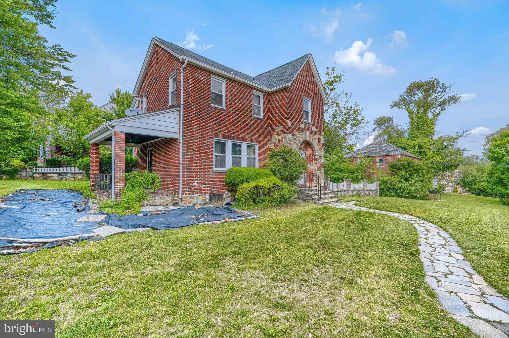 3212 Dorchester Road Baltimore, MD 21215 - Photo 2 of 45 a front view of a house with garden
