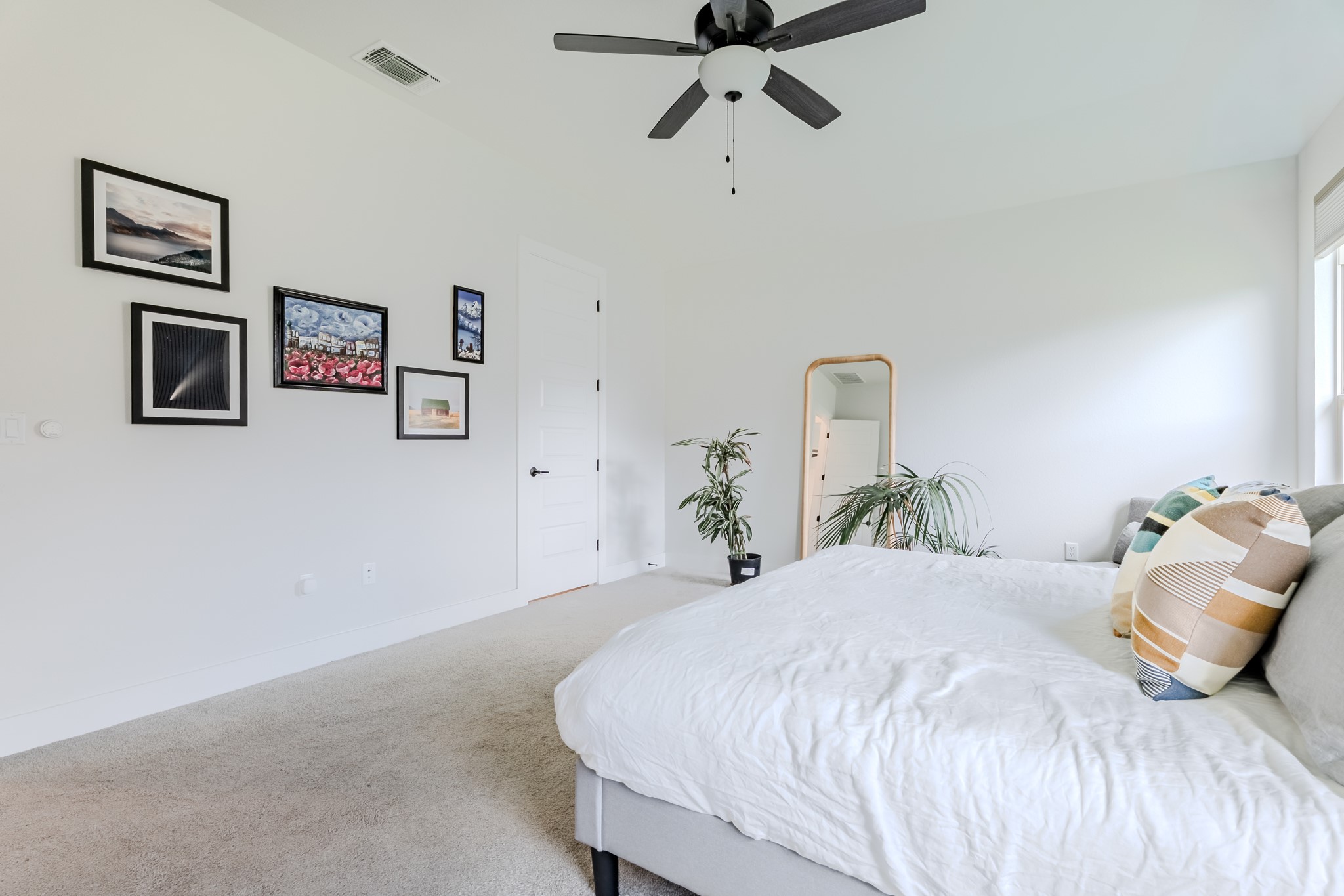 8109 Edmondson Bend Austin, TX 78744 - Photo 19 of 38 A well-lit bedroom offering a cozy retreat, featuring a quiet ceiling fan for comfort.