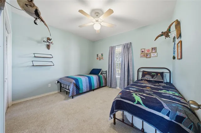 a bedroom with furniture and a chandelier