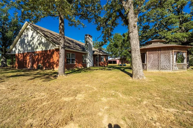 a view of a house with snow on the wall