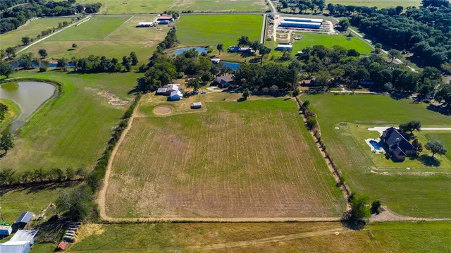 a view of a swimming pool with a yard