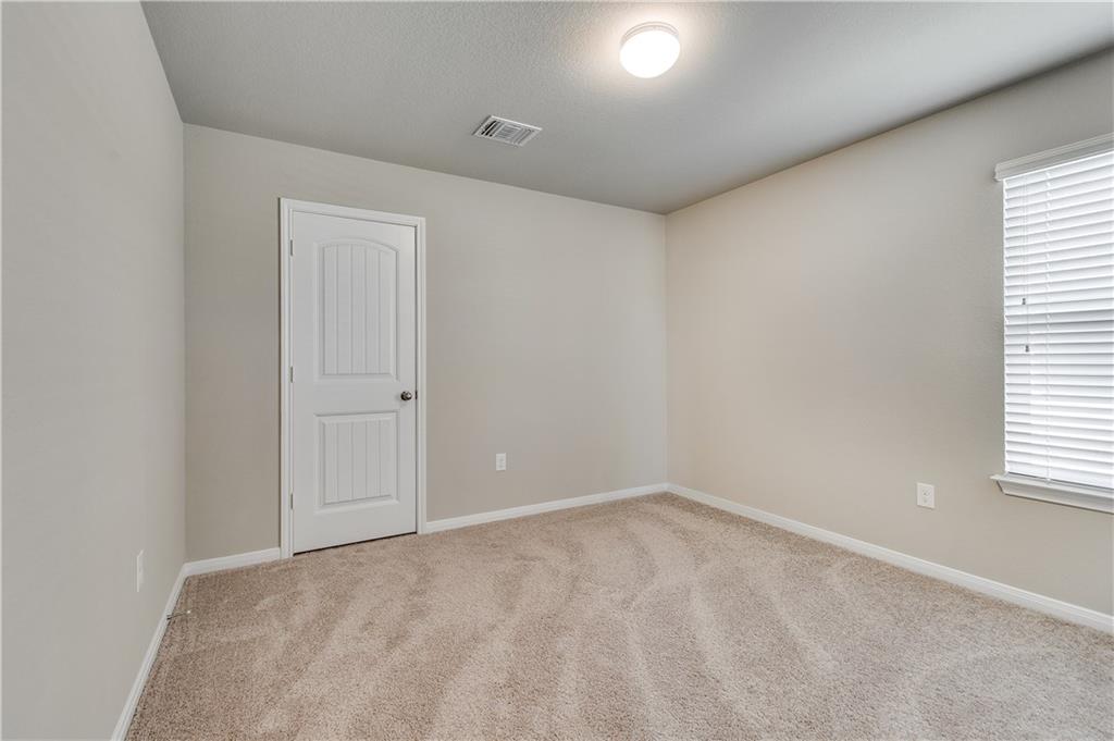 185 Voss Kyle, TX 78640 - Photo 18 of 26 an empty room with a window