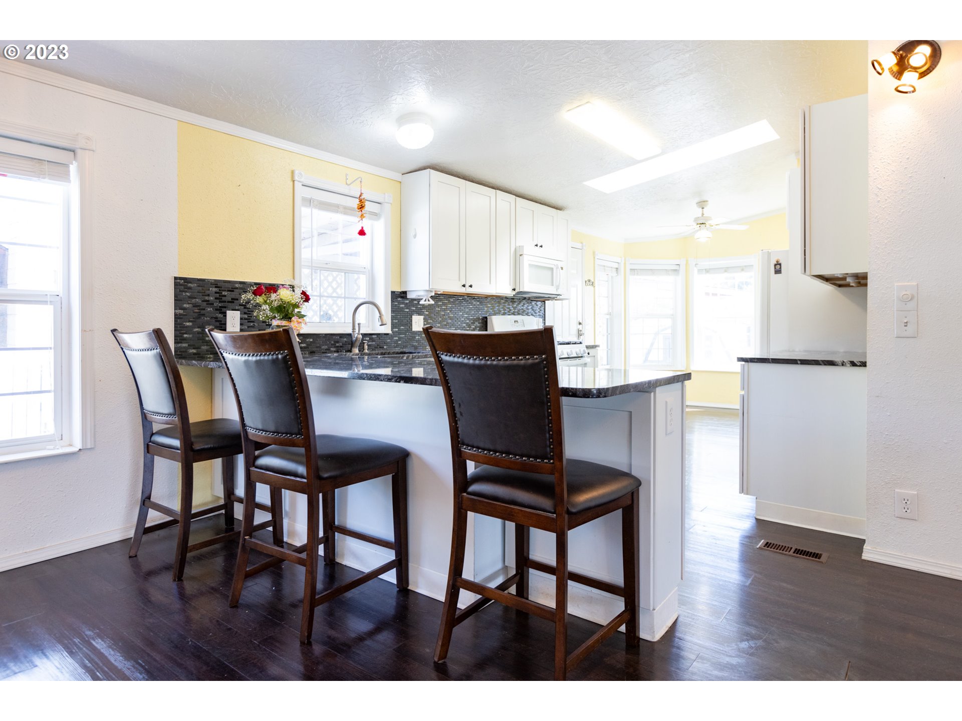 1045 Chenoweth Road The Dalles, OR 97058 - Photo 11 of 35 a view of a dining room with furniture and a window