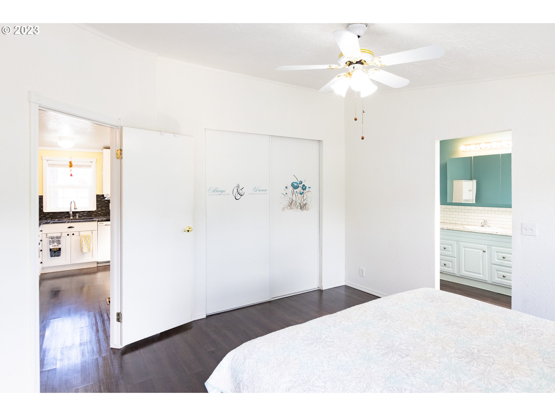 1045 Chenoweth Road The Dalles, OR 97058 - Photo 17 of 35 a bedroom with a bed and a chandelier