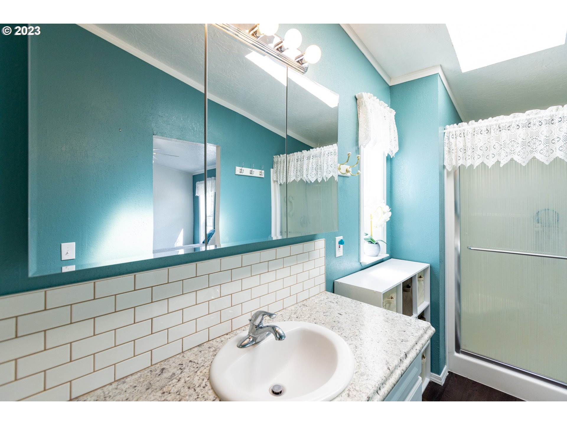 1045 Chenoweth Road The Dalles, OR 97058 - Photo 18 of 35 a bathroom with a sink and a mirror