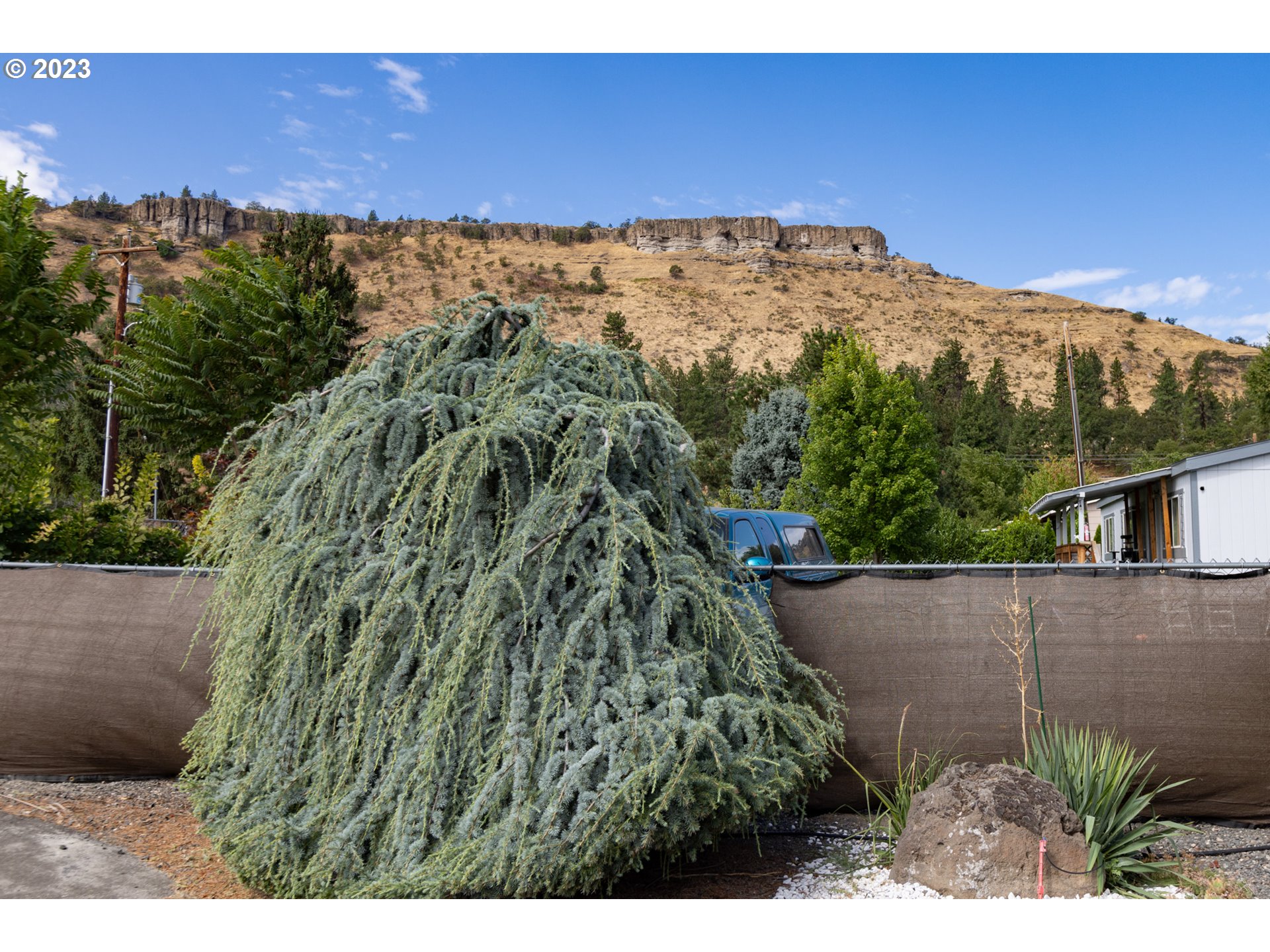 1045 Chenoweth Road The Dalles, OR 97058 - Photo 30 of 35 a view of a yard with an outdoor space