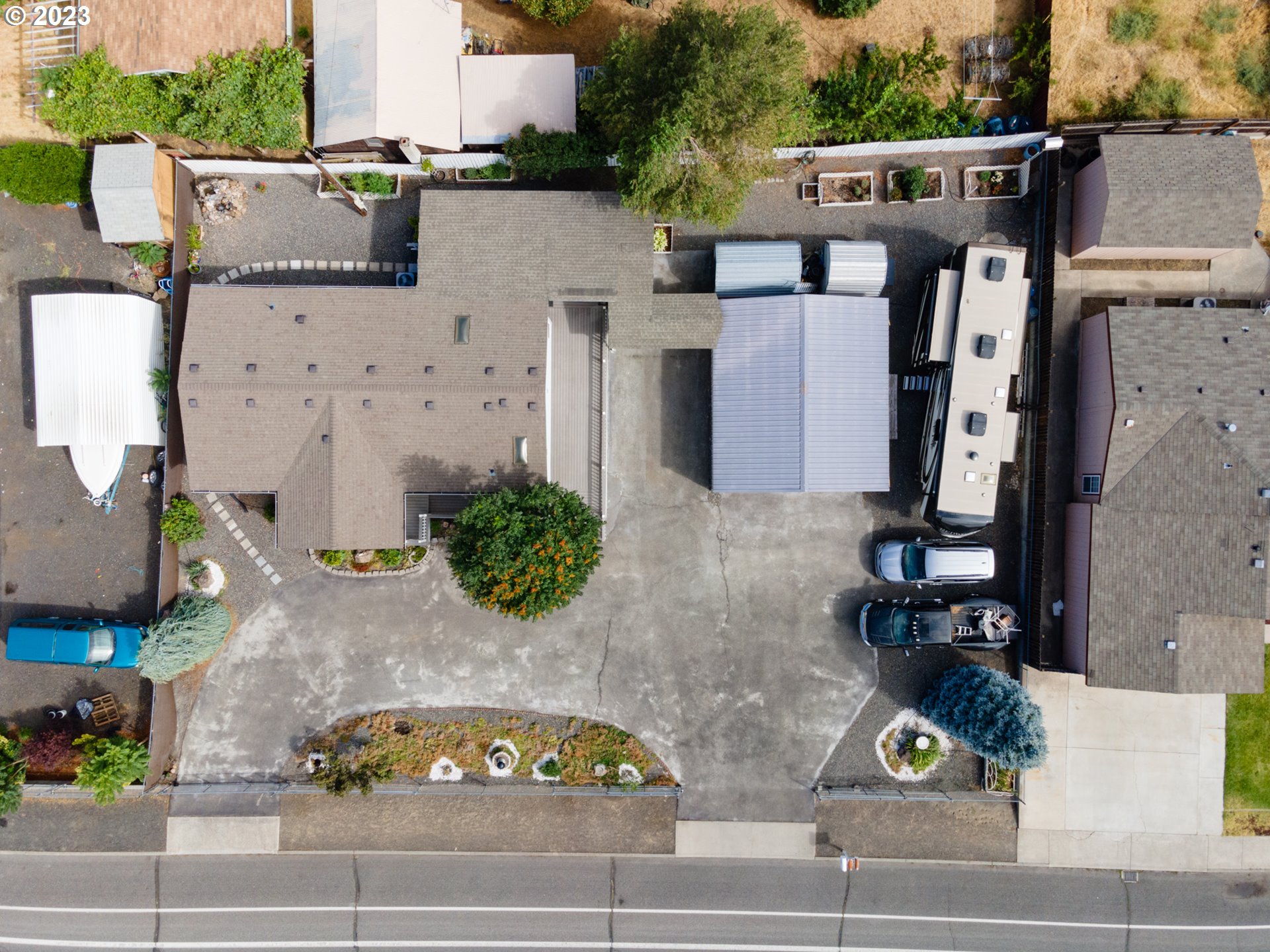 1045 Chenoweth Road The Dalles, OR 97058 - Photo 34 of 35 an aerial view of a house with car parked