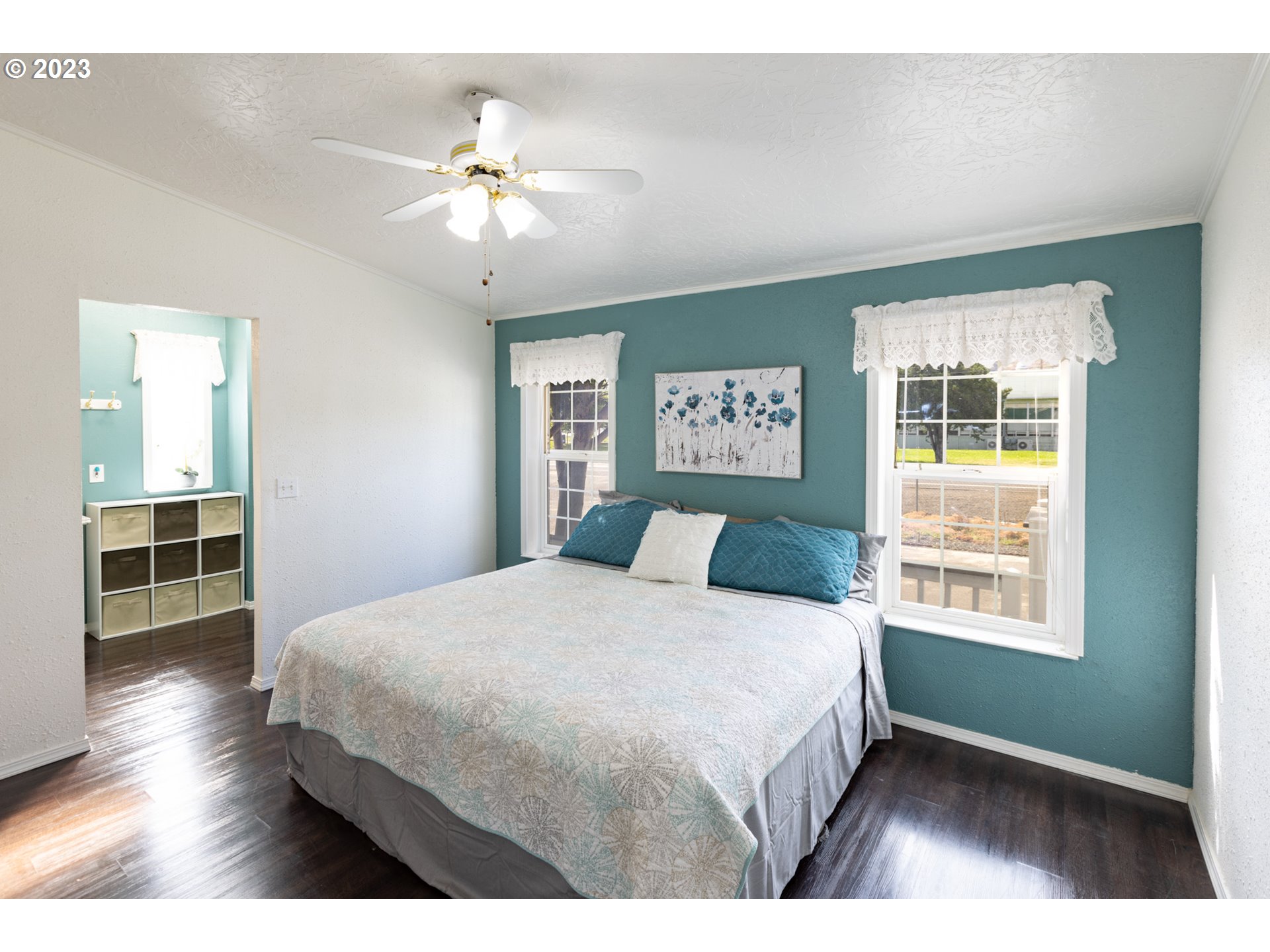 1045 Chenoweth Road The Dalles, OR 97058 - Photo 4 of 35 a bedroom with a large bed and a window