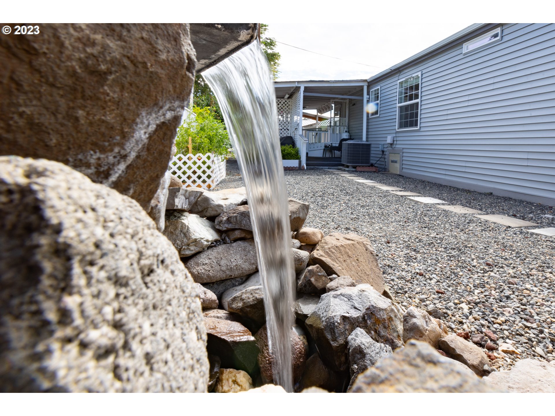 1045 Chenoweth Road The Dalles, OR 97058 - Photo 6 of 35 a view of backyard with roof deck and couches