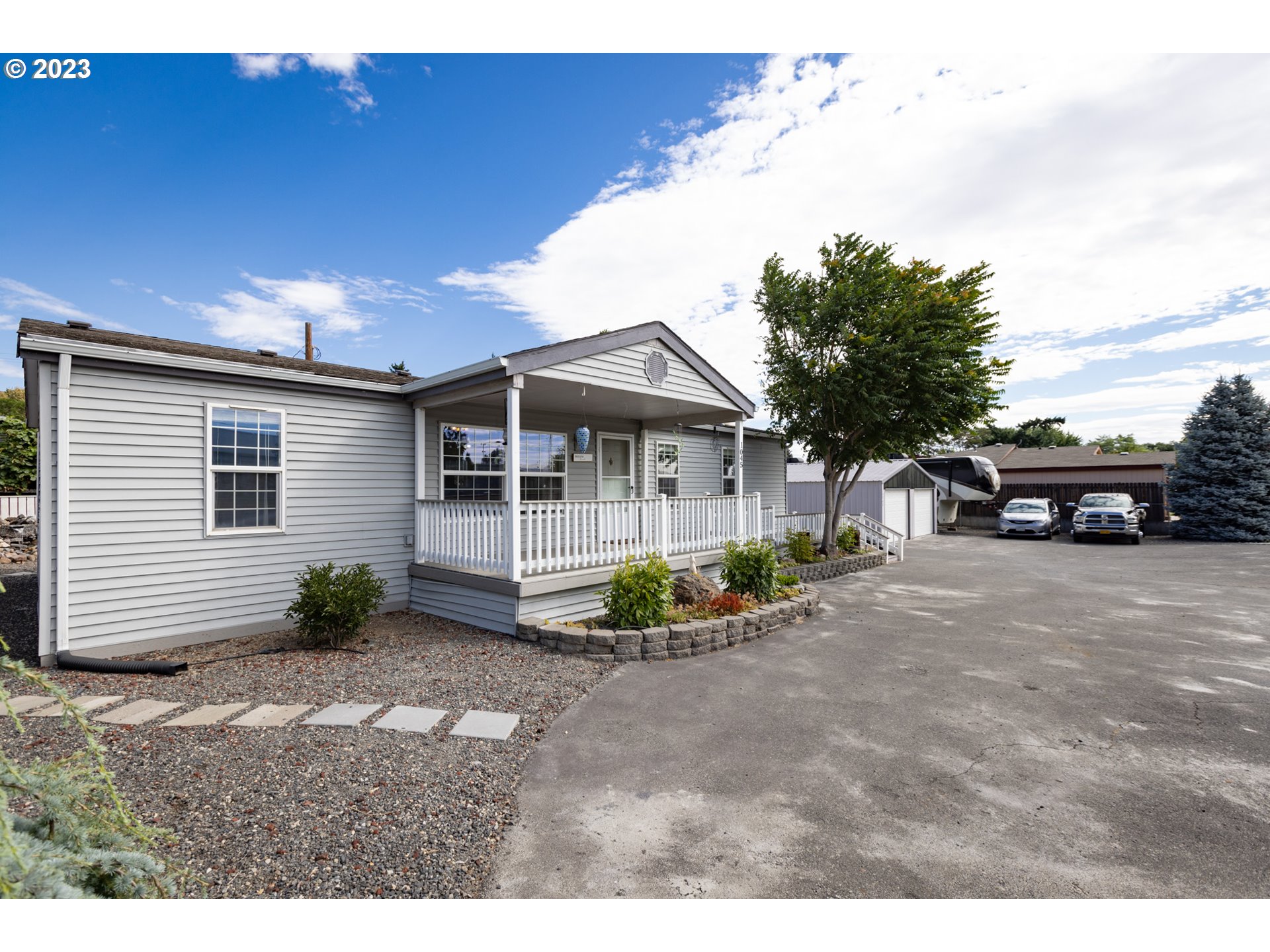 1045 Chenoweth Road The Dalles, OR 97058 - Photo 8 of 35 a front view of a house with garden