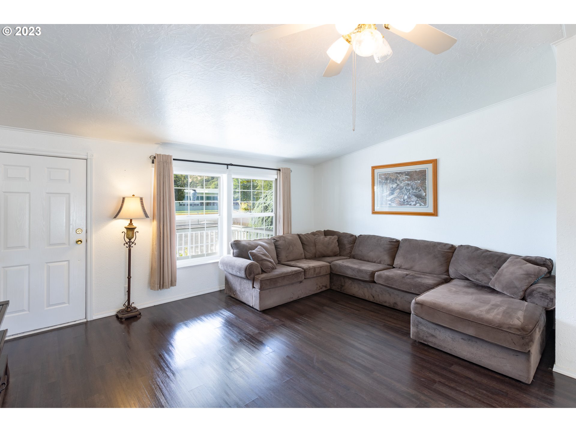 1045 Chenoweth Road The Dalles, OR 97058 - Photo 10 of 35 a living room with furniture and a wooden floor