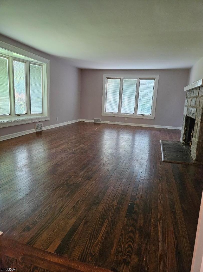 218 Devon Road Essex Fells, NJ 07021 - Photo 14 of 24 wooden floor in an empty room with a window