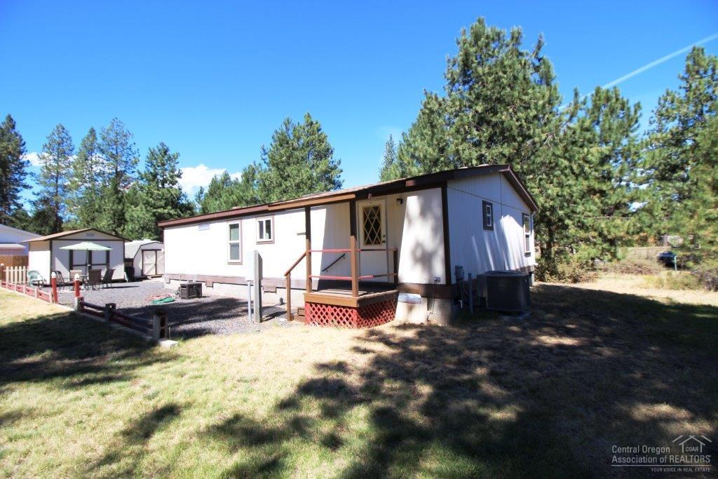 19235 Kiowa Road Bend, OR 97702 - Photo 20 of 25 a view of a house with backyard and sitting area