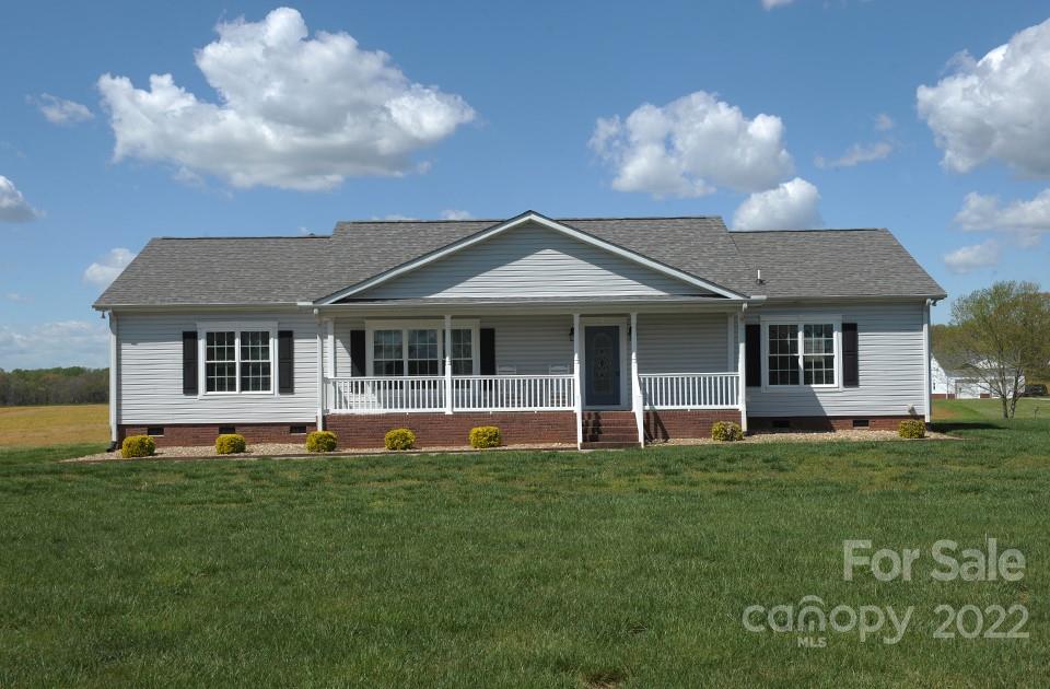 490 Cress Road Mount Ulla, NC 28125 - Photo 1 of 23 a front view of a house with a garden