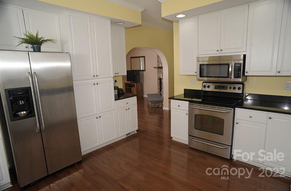490 Cress Road Mount Ulla, NC 28125 - Photo 11 of 23 a kitchen with stainless steel appliances granite countertop a stove a refrigerator and a microwave