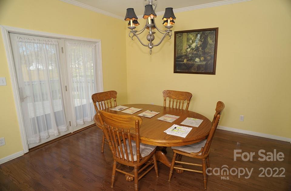 490 Cress Road Mount Ulla, NC 28125 - Photo 15 of 23 a view of a dining room with furniture and wooden floor