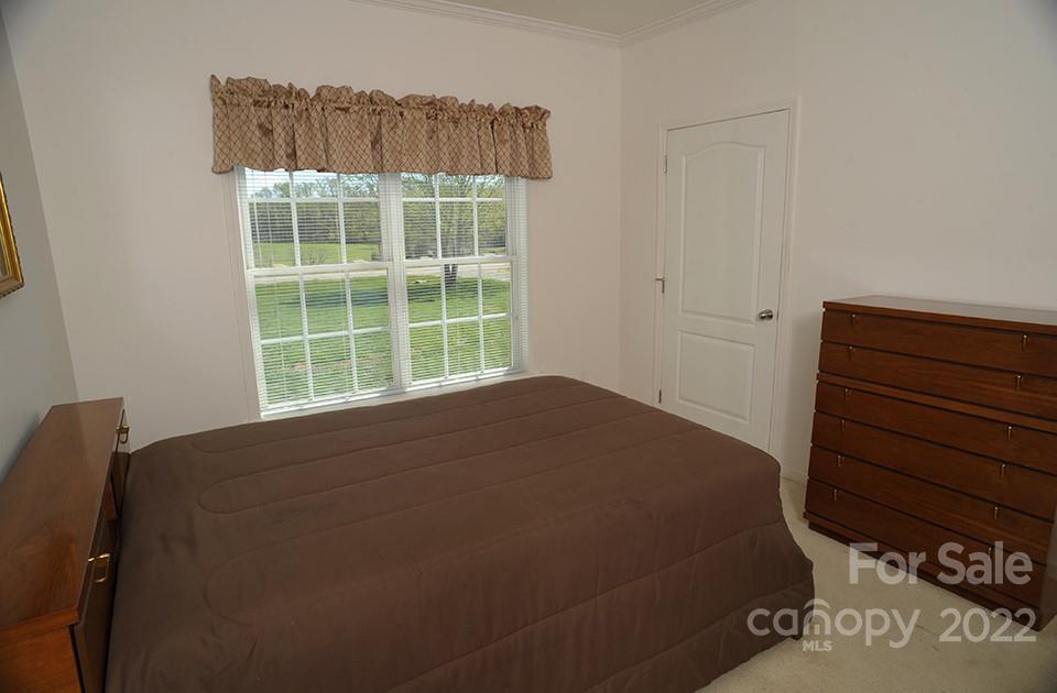 490 Cress Road Mount Ulla, NC 28125 - Photo 18 of 23 a bedroom with a bed and a window