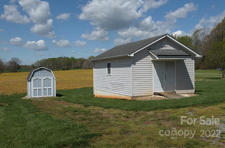 490 Cress Road Mount Ulla, NC 28125 - Photo 23 of 23 a view of a house with a yard
