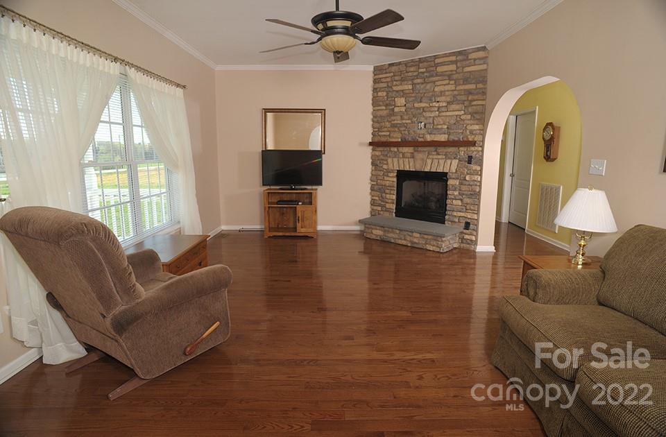 490 Cress Road Mount Ulla, NC 28125 - Photo 5 of 23 a living room with furniture and a fireplace
