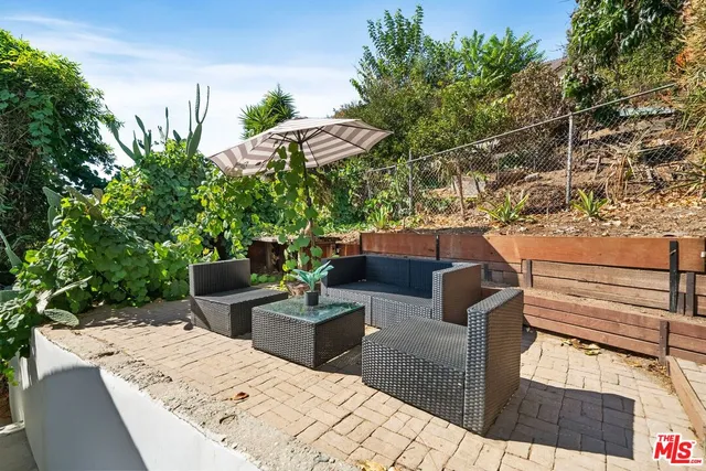a view of a terrace with furniture