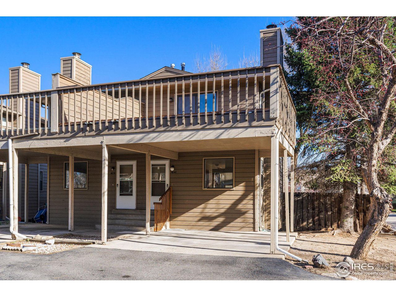 a view of a house with a iron gate