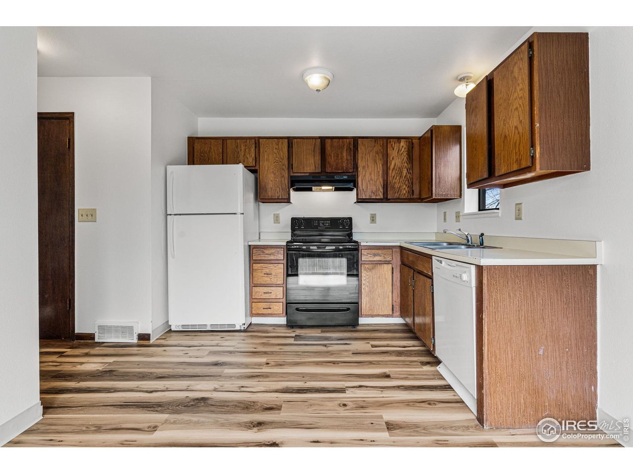 4640 Portside Way Boulder, CO 80301 - Photo 11 of 35 a kitchen with a refrigerator and a sink
