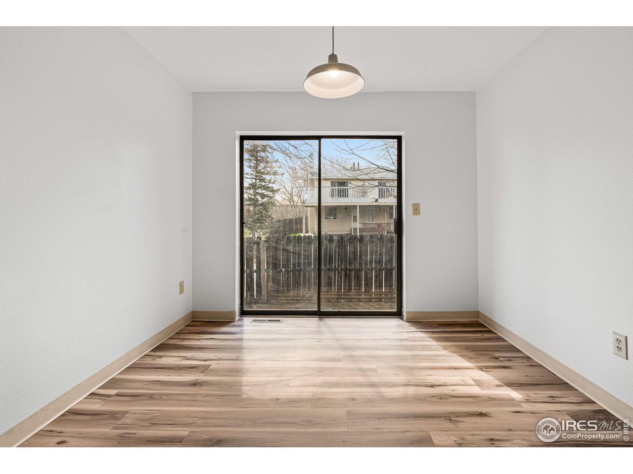 4640 Portside Way Boulder, CO 80301 - Photo 12 of 35 a view of an empty room with wooden floor