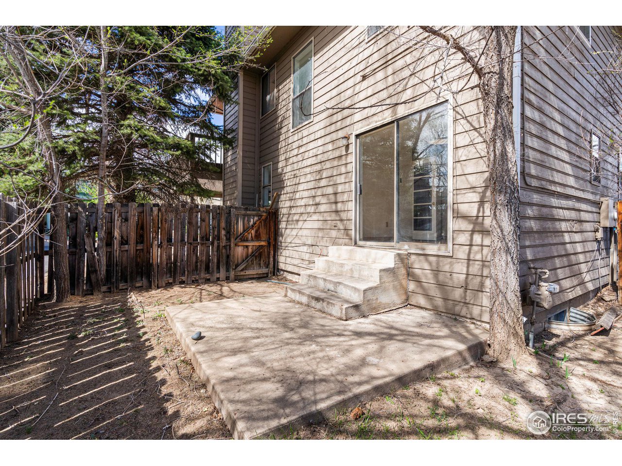 4640 Portside Way Boulder, CO 80301 - Photo 15 of 35 a backyard of a house with table and chairs