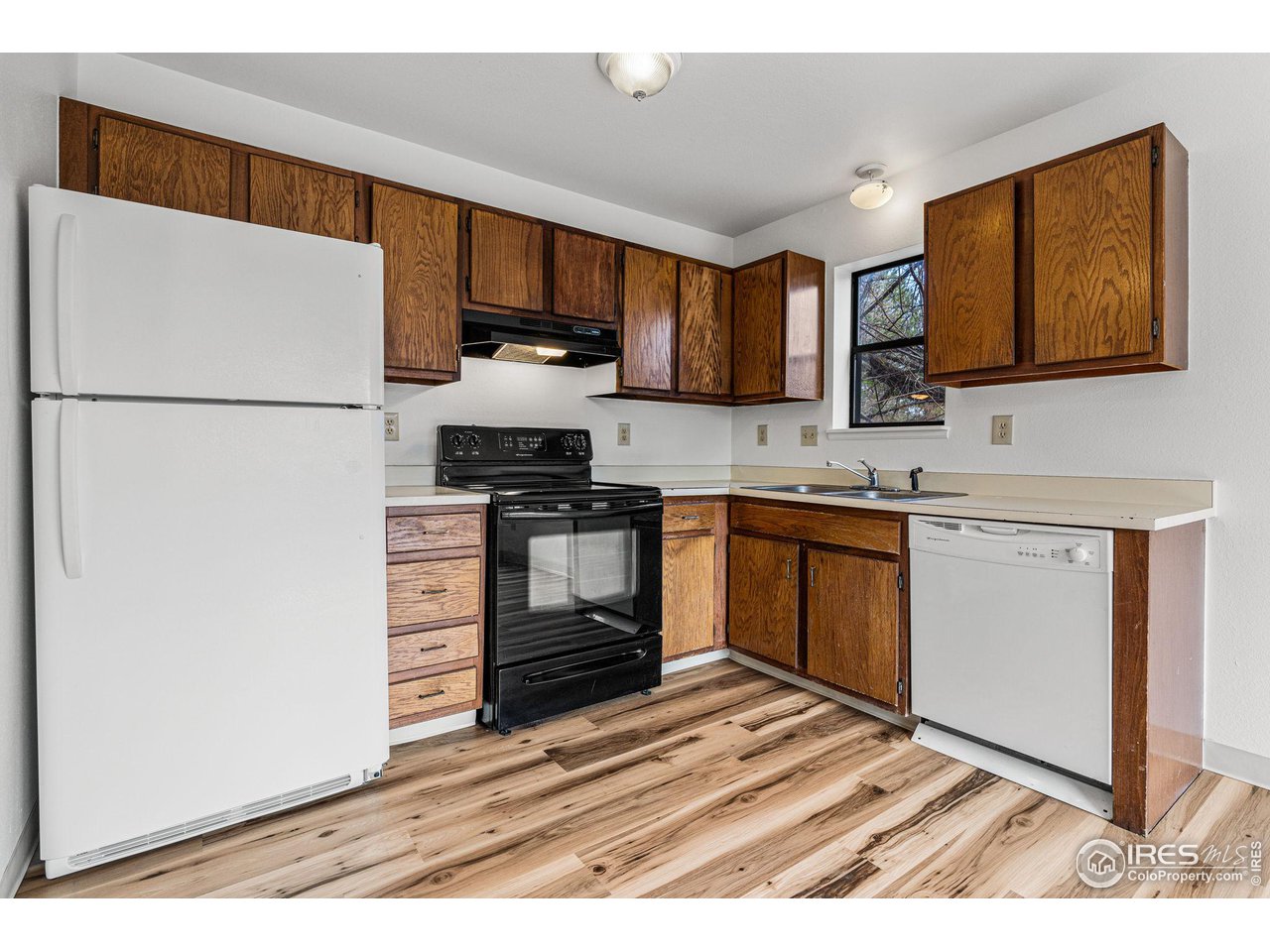 4640 Portside Way Boulder, CO 80301 - Photo 10 of 35 a kitchen with stainless steel appliances a refrigerator stove and sink
