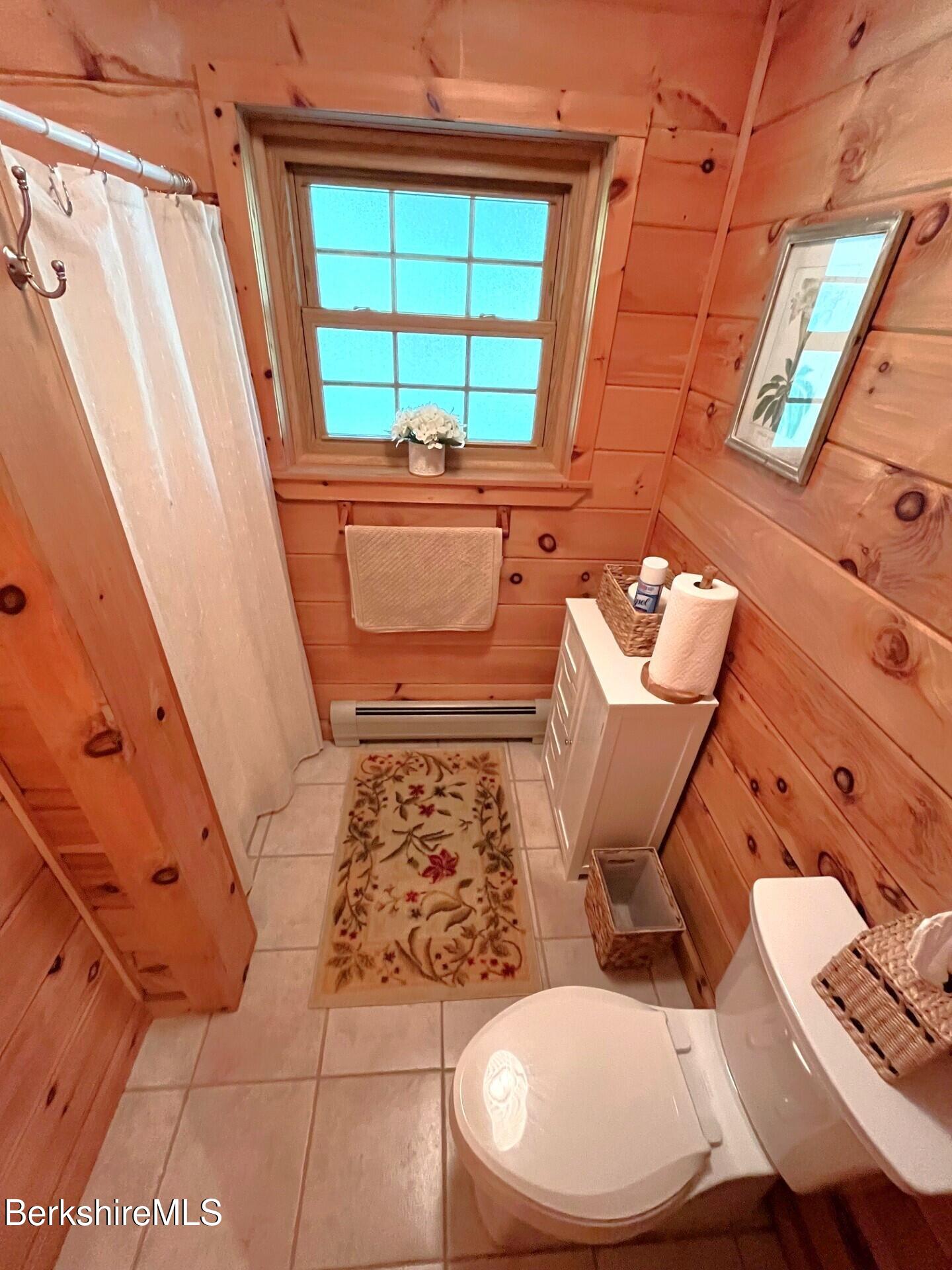 1020 Cascade Street Pittsfield, MA 01201 - Photo 13 of 75 a bathroom with a toilet sink and mirror