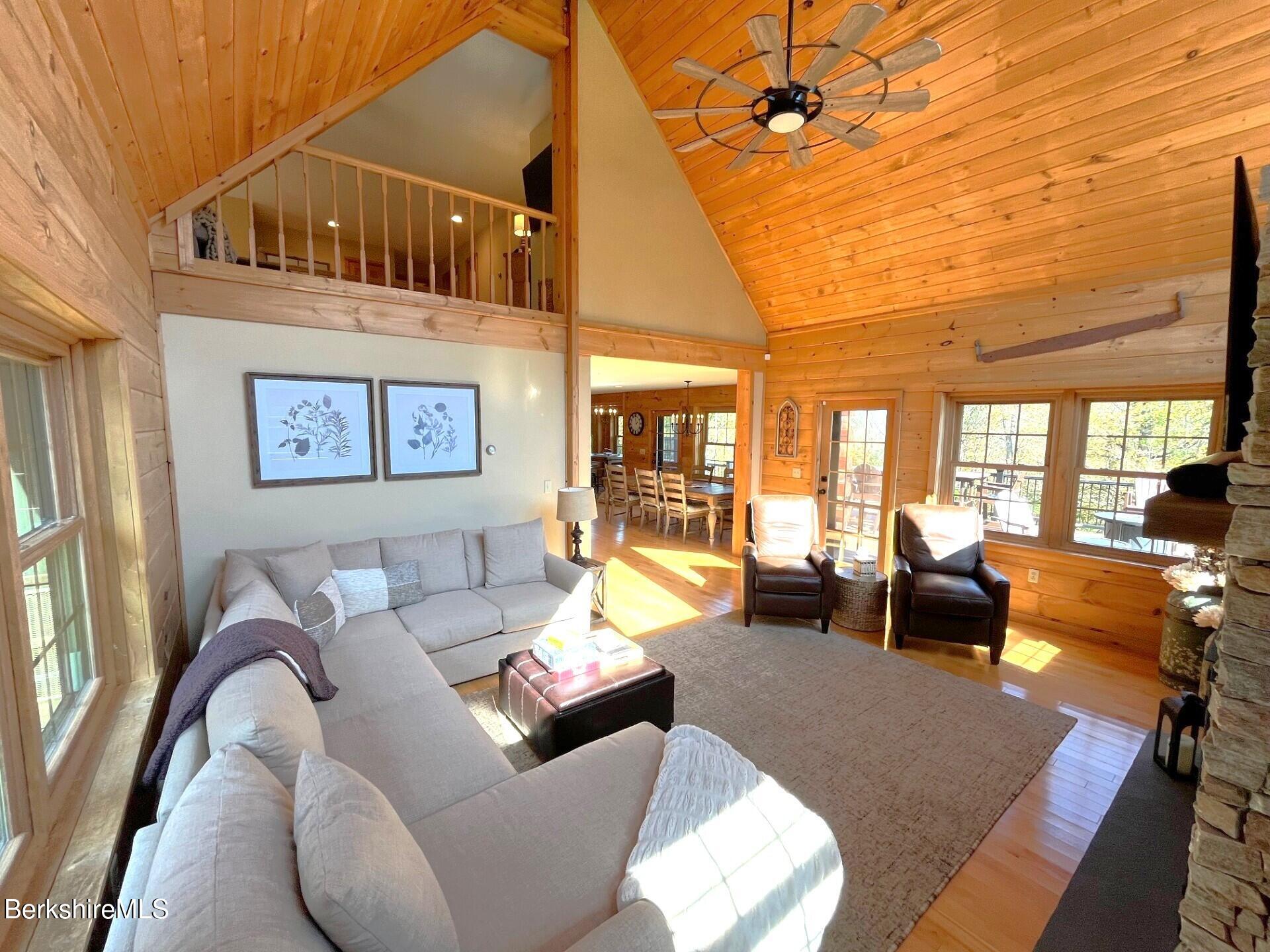 1020 Cascade Street Pittsfield, MA 01201 - Photo 24 of 75 a living room with furniture and a chandelier